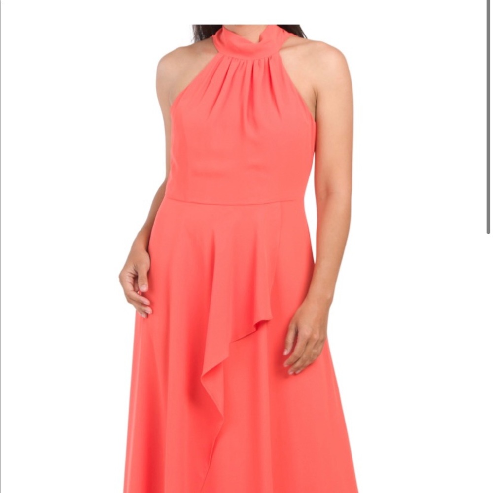 Tangerine long gown. Zip up in back. Size 10